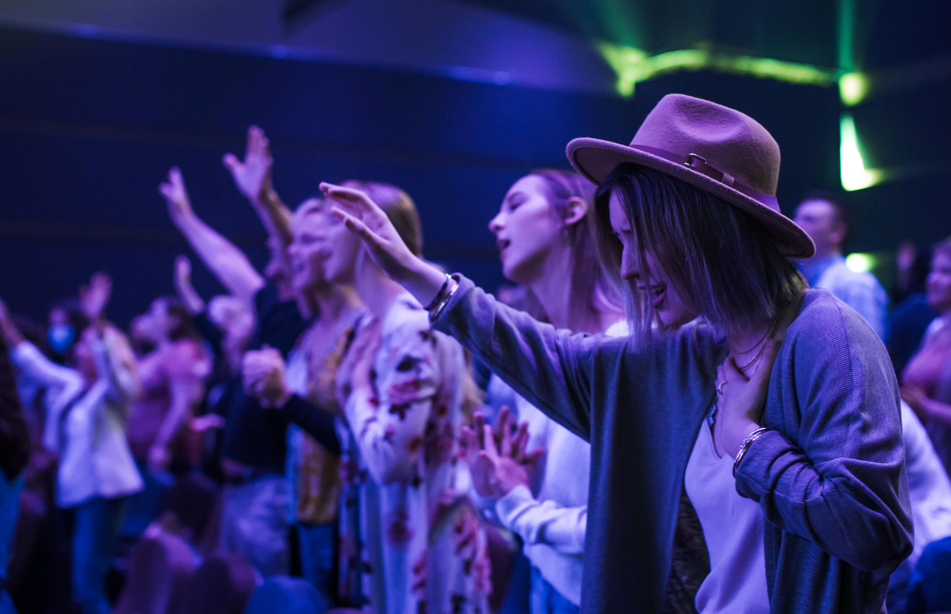 Women with thier hands up in prayer
